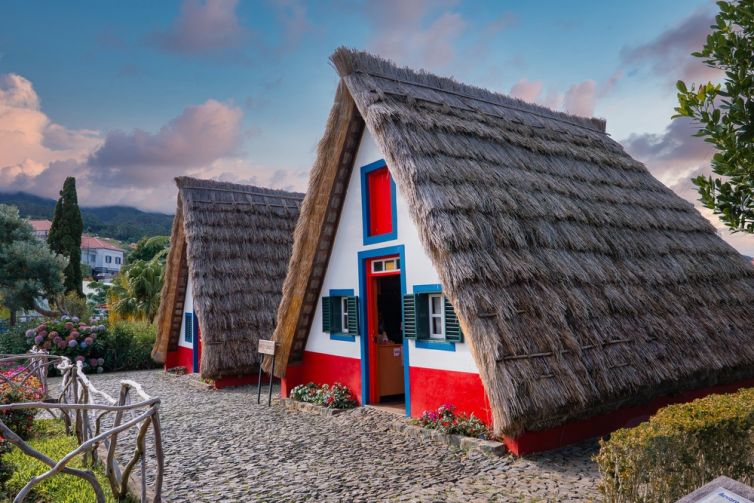 Two,Traditional,A,Frame,Thatched,Houses,With,White,Walls,And