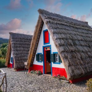 Two,Traditional,A,Frame,Thatched,Houses,With,White,Walls,And
